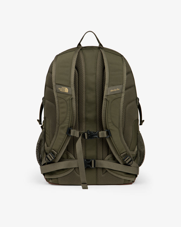 ALD / The North Face Borealis Backpack in olive green with padded straps, mesh back, and black buckles, rear view.