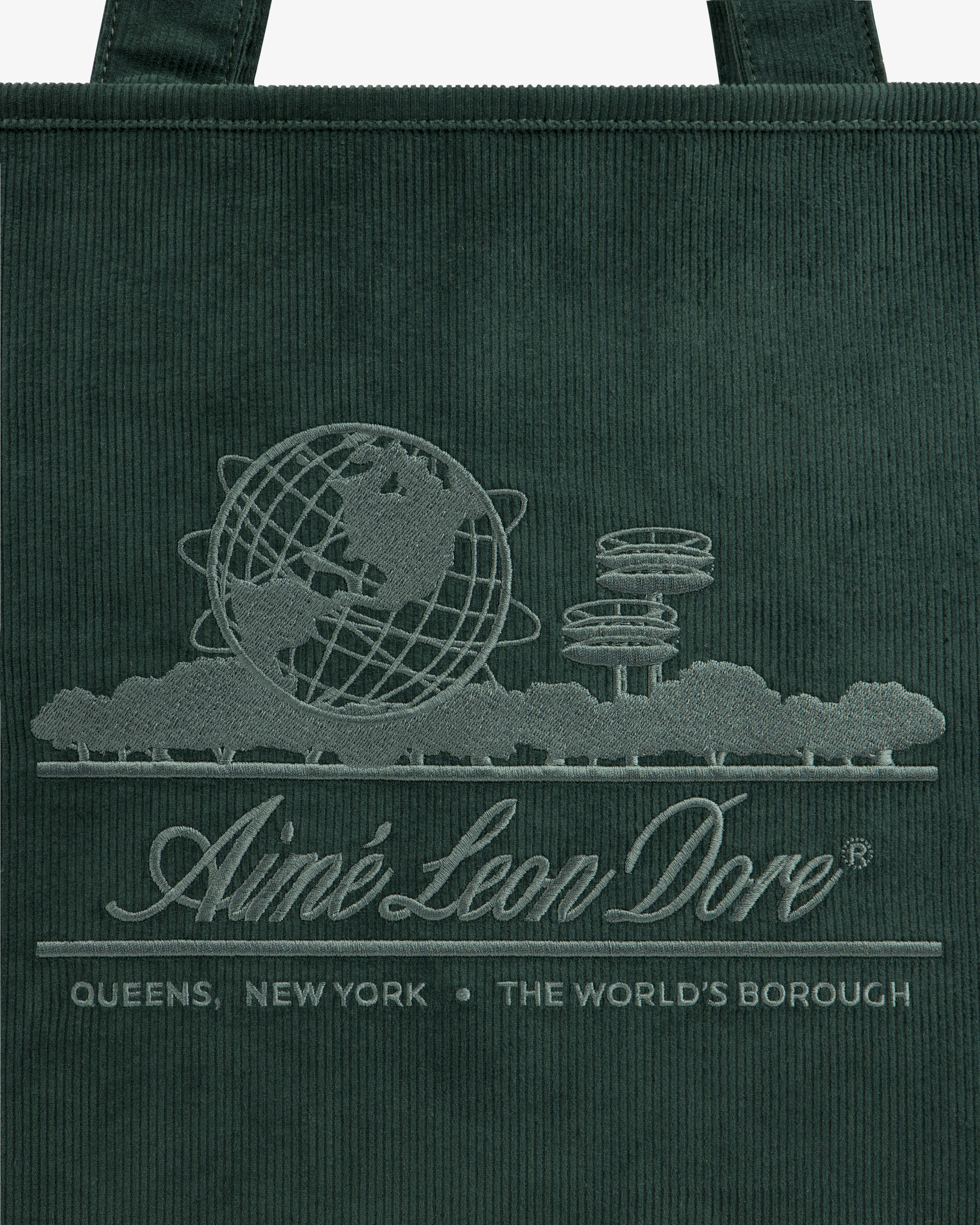 Large Corduroy Unisphere Tote Bag in dark green, featuring an embroidered globe, towers, and Aimé Leon Dore branding.