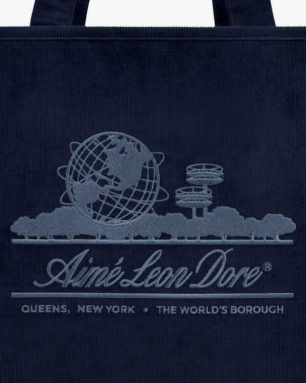 Large Corduroy Unisphere Tote Bag in dark navy with an embroidered Unisphere, brand name, and QUEENS, NEW YORK.