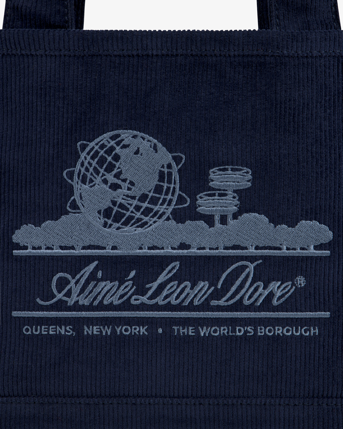 Mini Corduroy Unisphere Tote Bag in dark blue, featuring an embroidered Unisphere, trees, and Aimé Leon Dore branding.