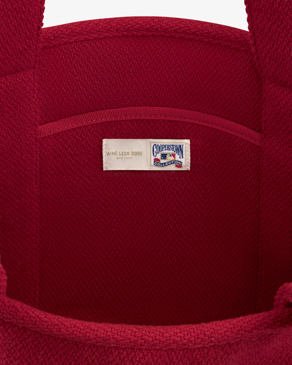 Interior of a red wool NY Highlanders Wool Tote Bag featuring a Cooperstown Collection label.