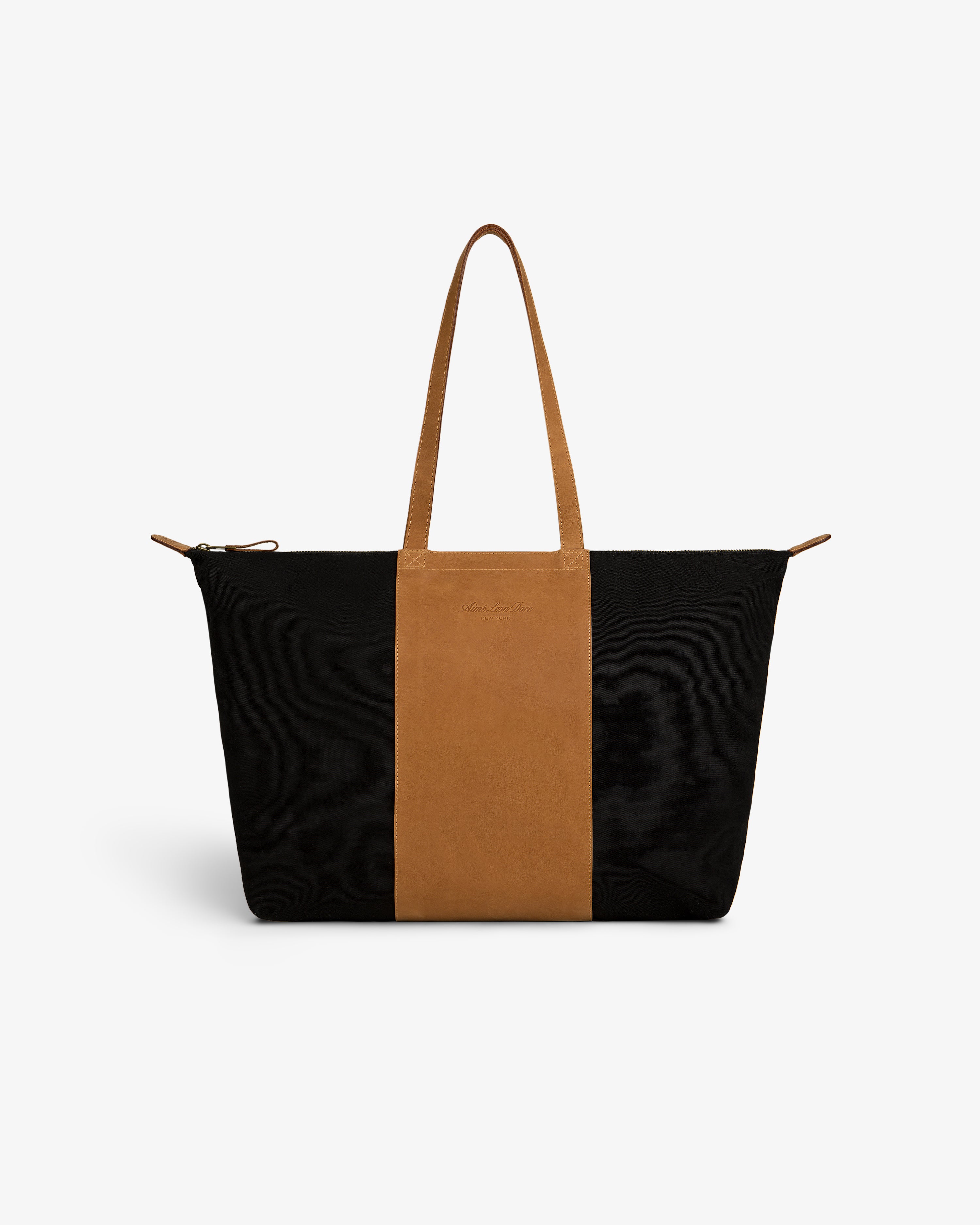 Leather Canvas Zip Tote with black sides, brown center panel & handles, shown on a white background.