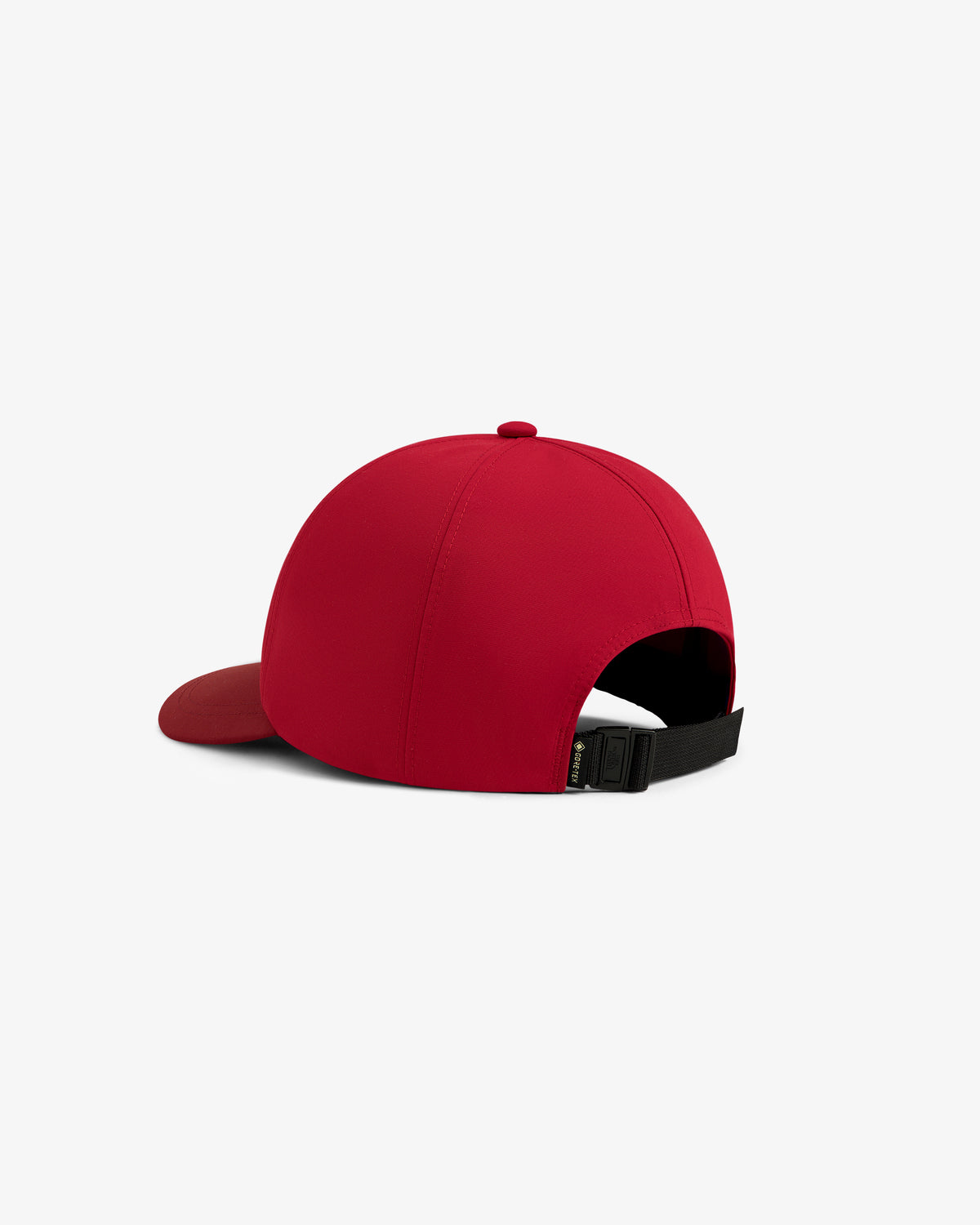 The ALD / The North Face GORE-TEX Hat in red, viewed from the back with a black adjustable strap and curved brim.
