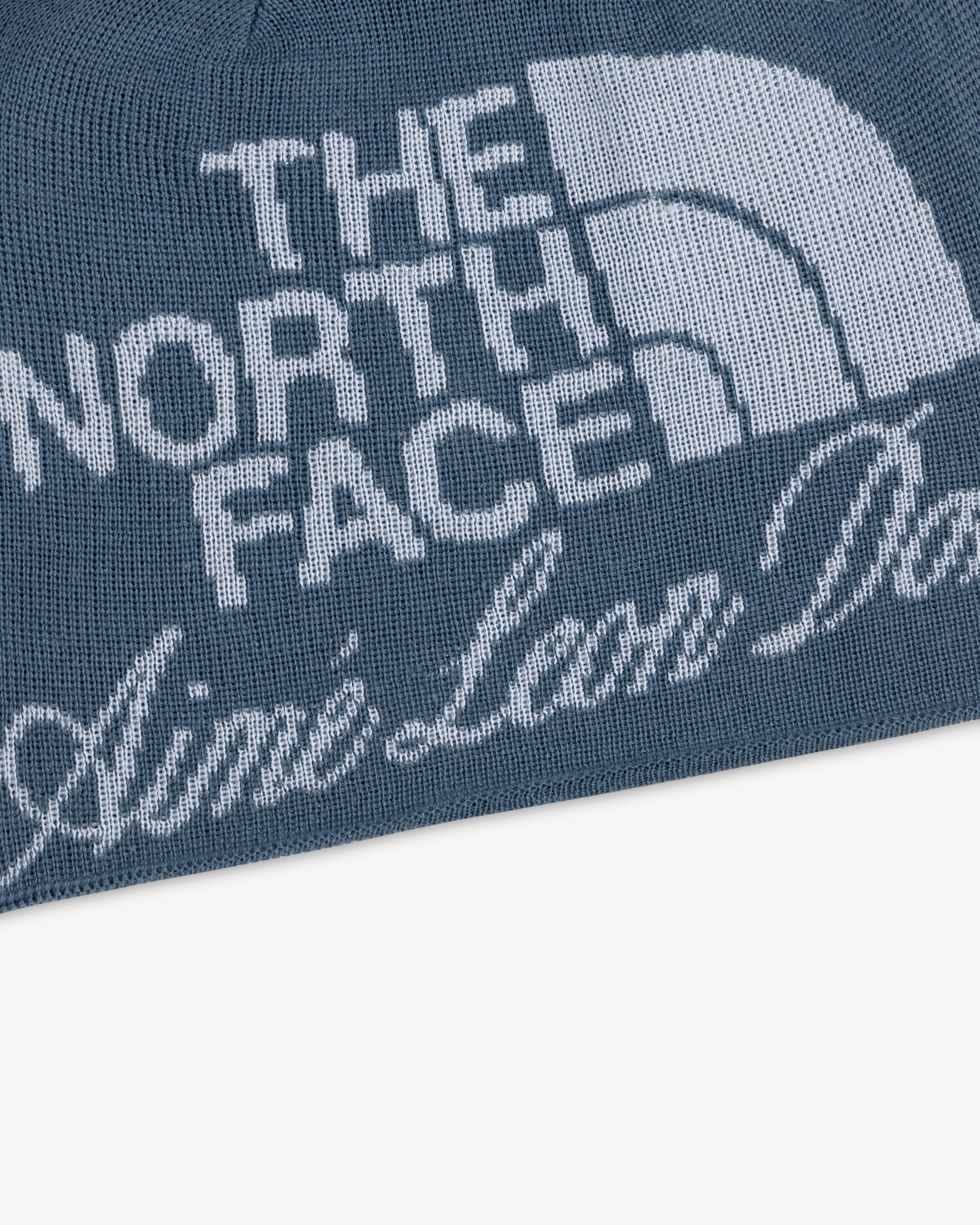 ALD / The North Face Jacquard Beanie in blue knit with white logo and Aime Leon Dore script on the front.