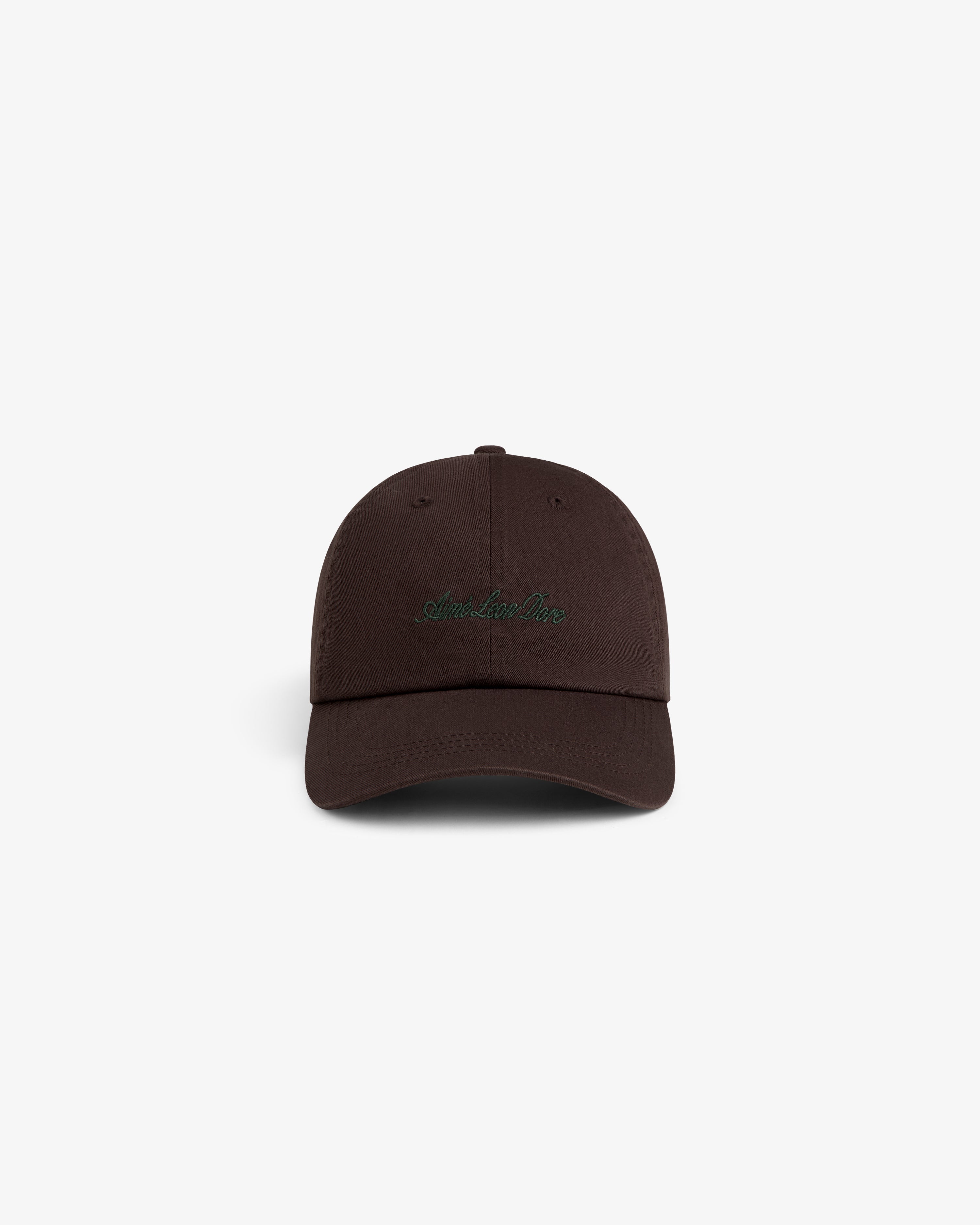 Washed Script Chino Hat in dark brown with green embroidered text, shown on a plain white background.