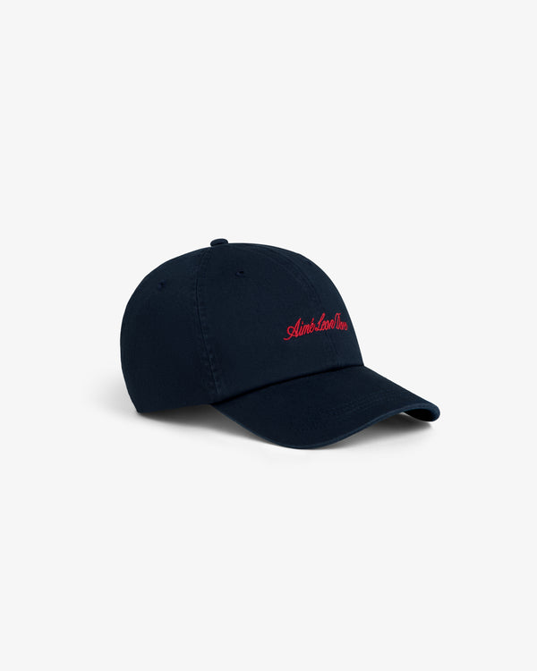 Washed Script Chino Hat in navy with red Aimé Leon Dore embroidery, displayed on a white background.