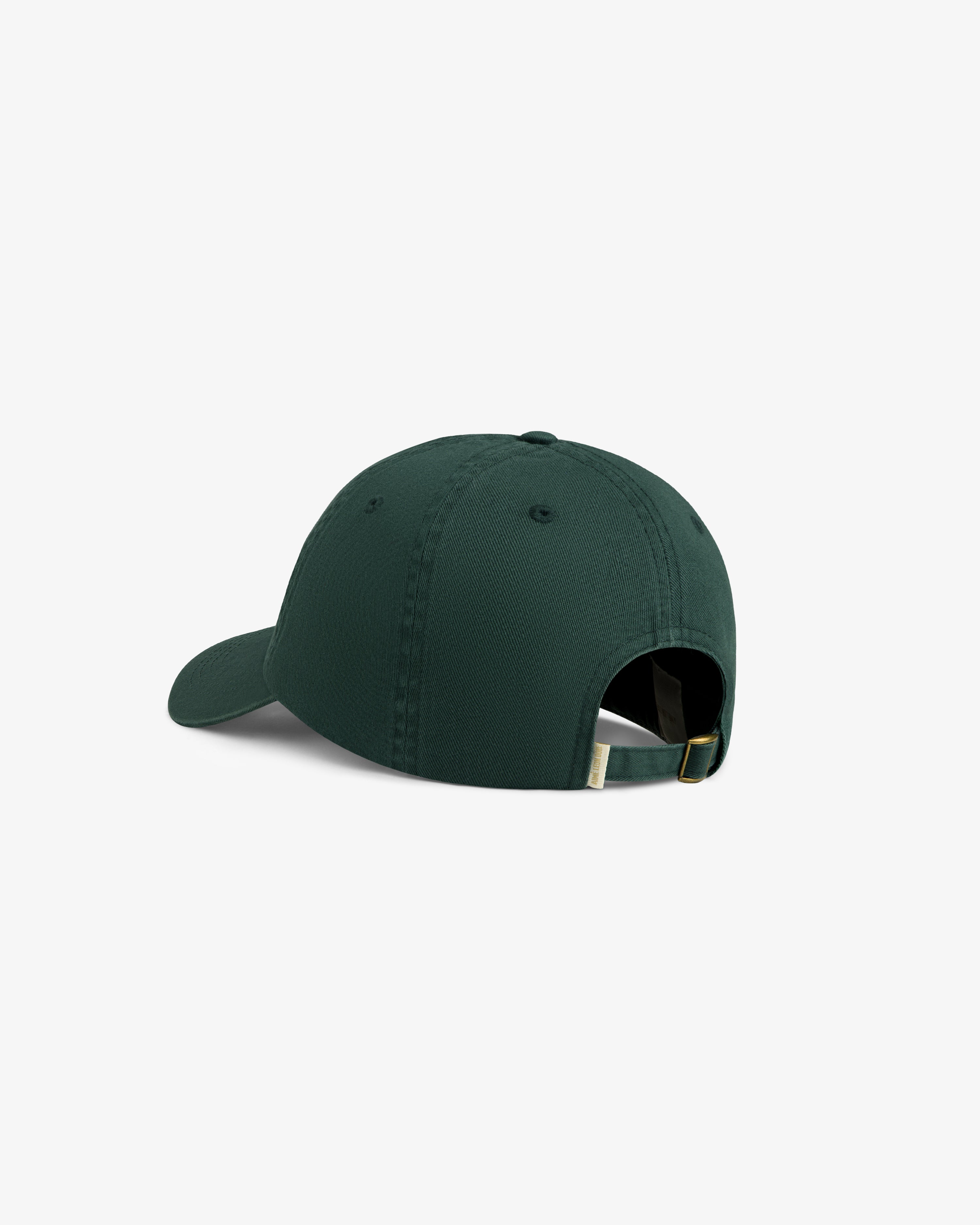The Washed Script Chino Hat in dark green features an adjustable strap and metal buckle, shown from the back.