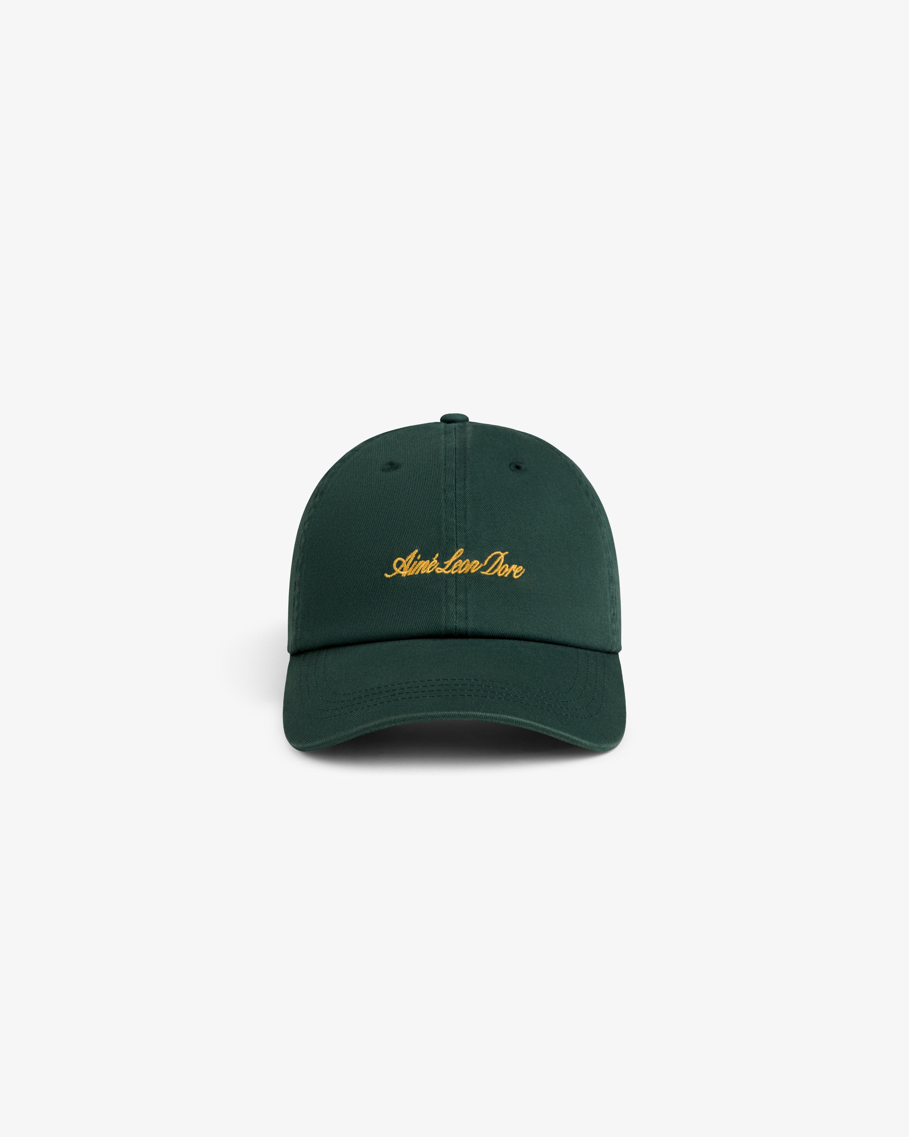 Washed Script Chino Hat in dark green with yellow Aimé Leon Dore text, displayed on a white background.
