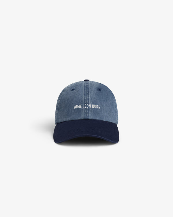 Pigment Dyed Logo Hat: Blue denim cap with navy brim, Aimé Leon Dore logo embroidered in white on front.