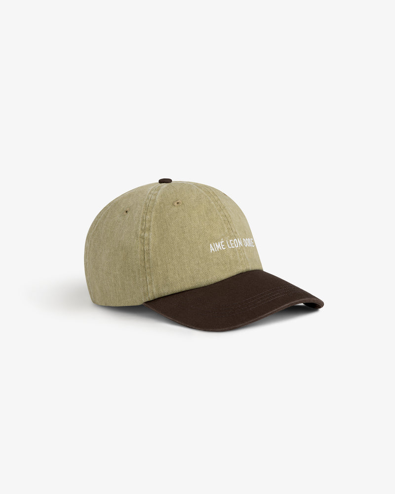 Pigment Dyed Logo Hat in olive with a dark brown brim and AIMÉ LEON DORE embroidered white on the front.