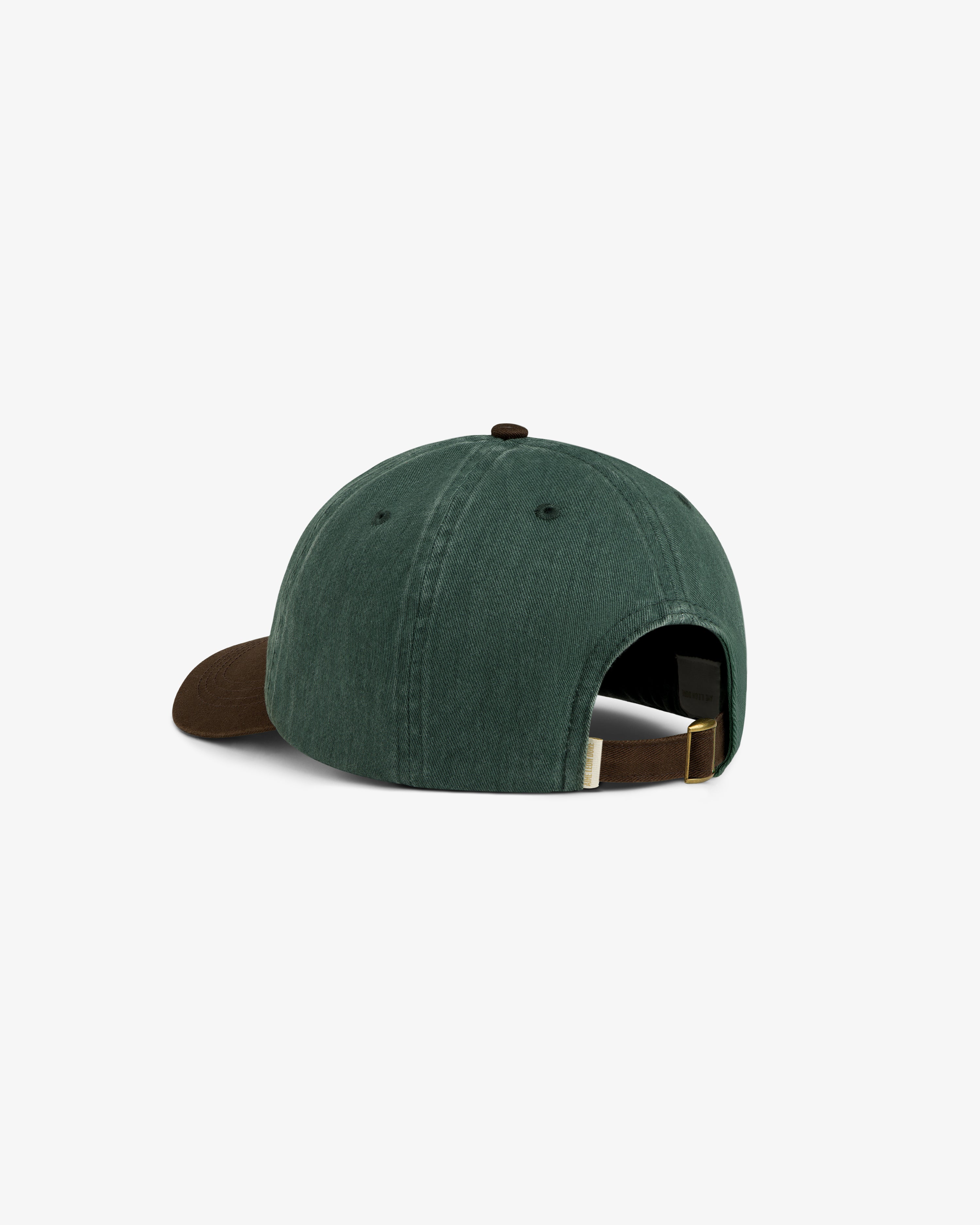 Pigment Dyed Logo Hat in green with brown brim, shown from back with adjustable strap and metal buckle.