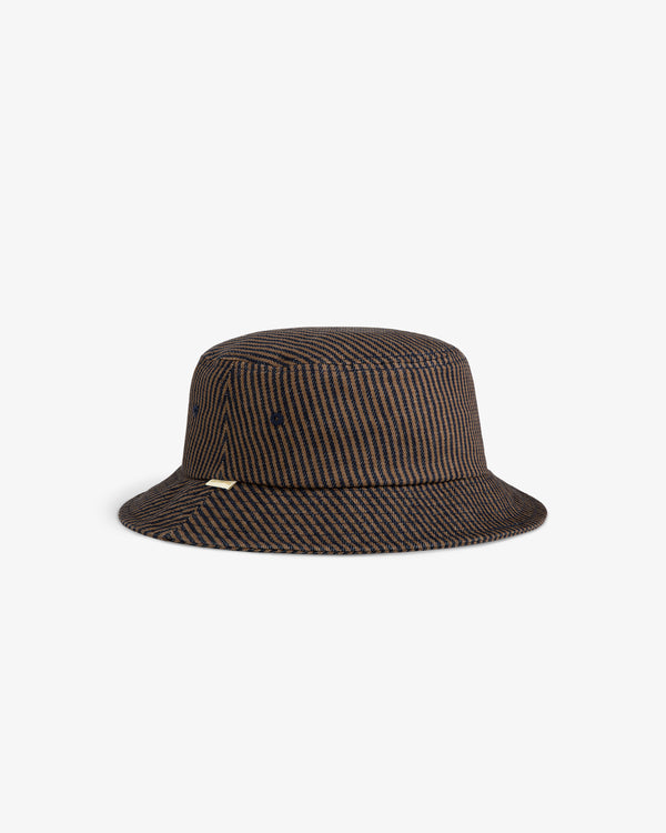 Hickory Stripe Bucket Hat in brown and black with gold tag on the left side, shown on white background.