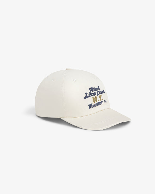 Mulberry Chainstitch Hat: Cream cap with blue and yellow Aimé Leon Dore N.Y. MULBERRY ST. front embroidery.