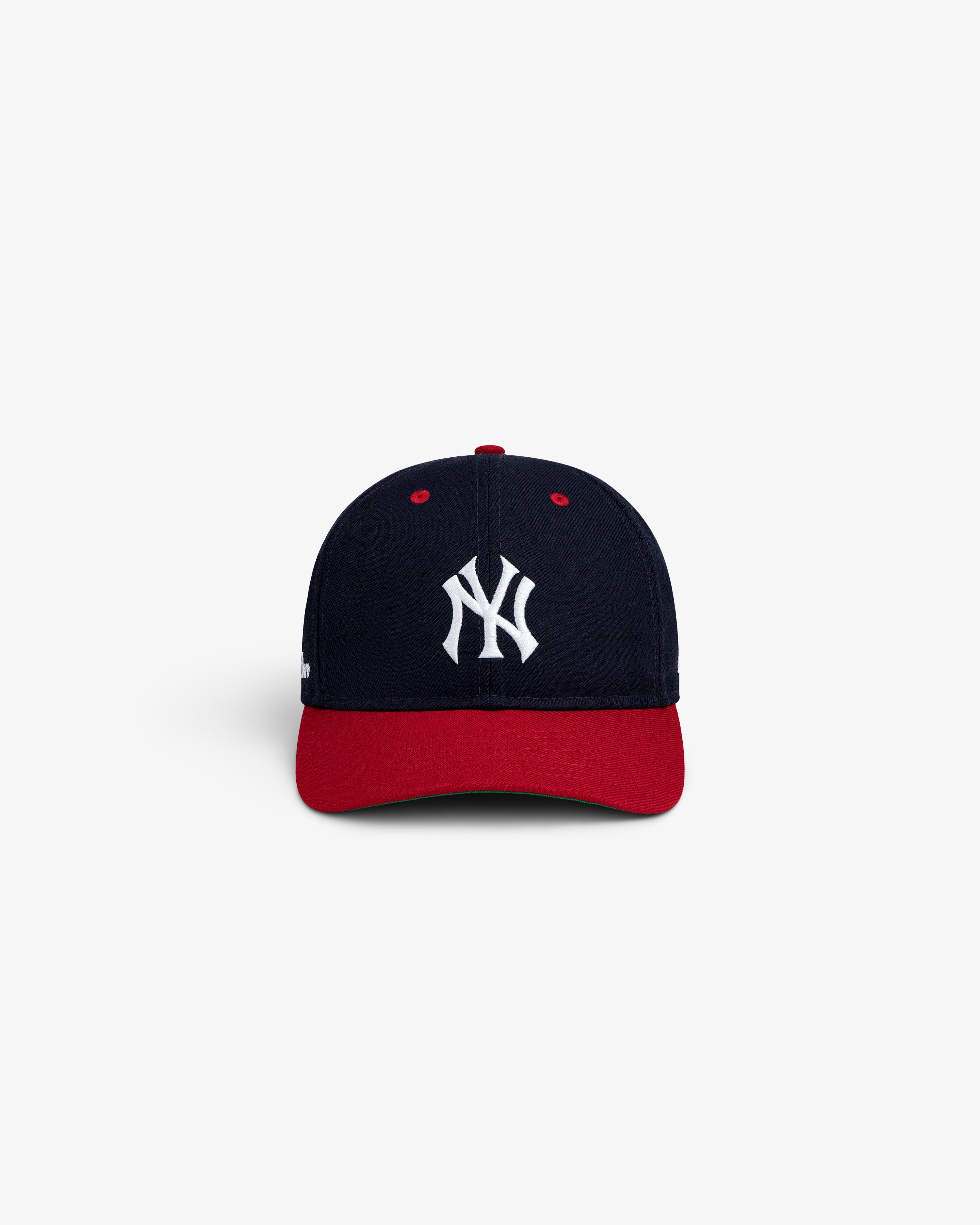 ALD / New Era Yankees Retro Fit Hat in navy with a red brim and white Yankees logo on the front.