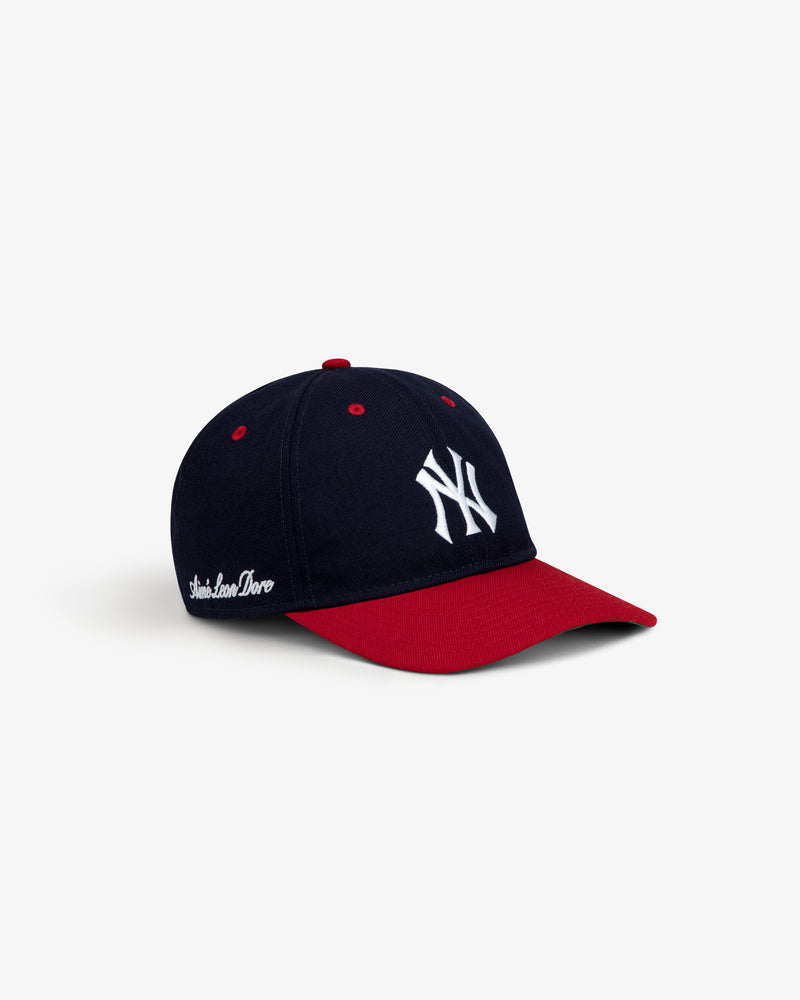 ALD / New Era Yankees Retro Fit Hat: navy blue baseball cap with a red brim, white embroidered logo, and red eyelets.