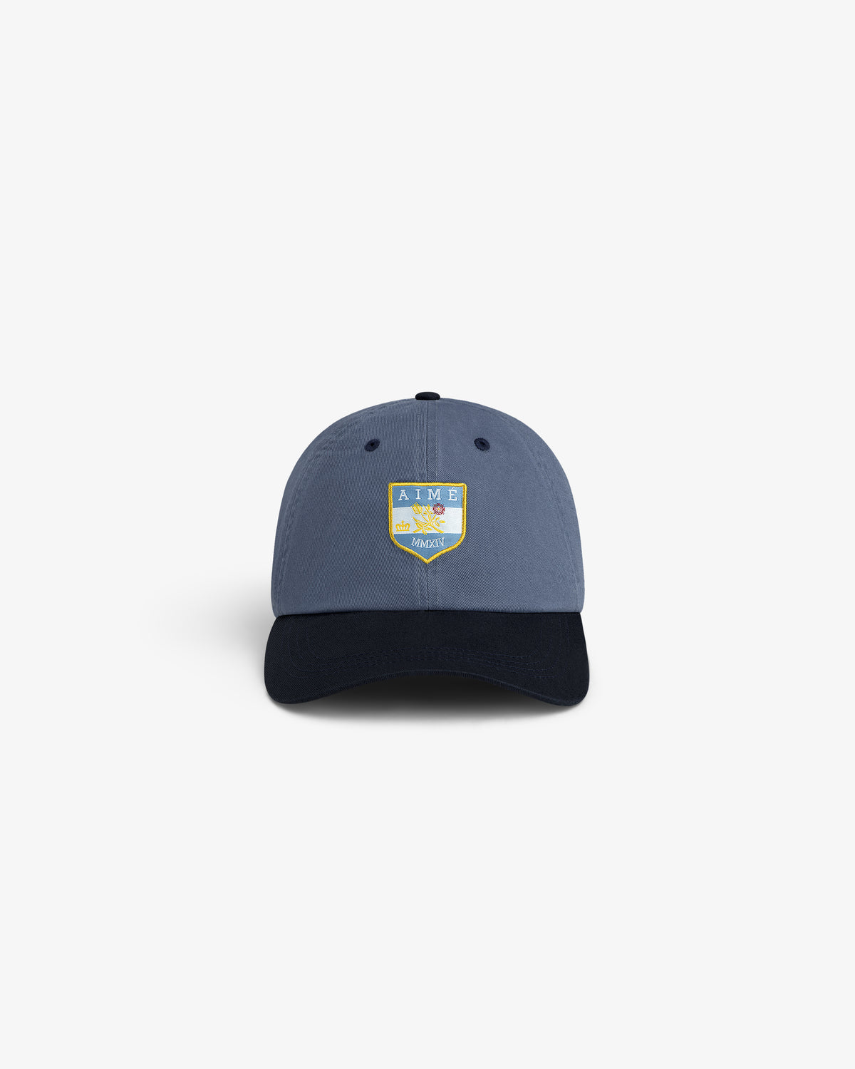 Crest Shield Hat: Blue cap with yellow and green AIME patch embroidered on the front.
