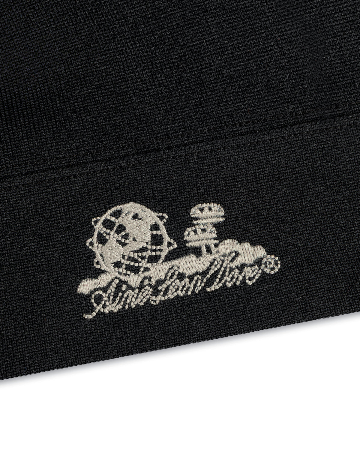Unisphere Skull Cap: black fabric, white embroidered globe & mushrooms above stylized script.