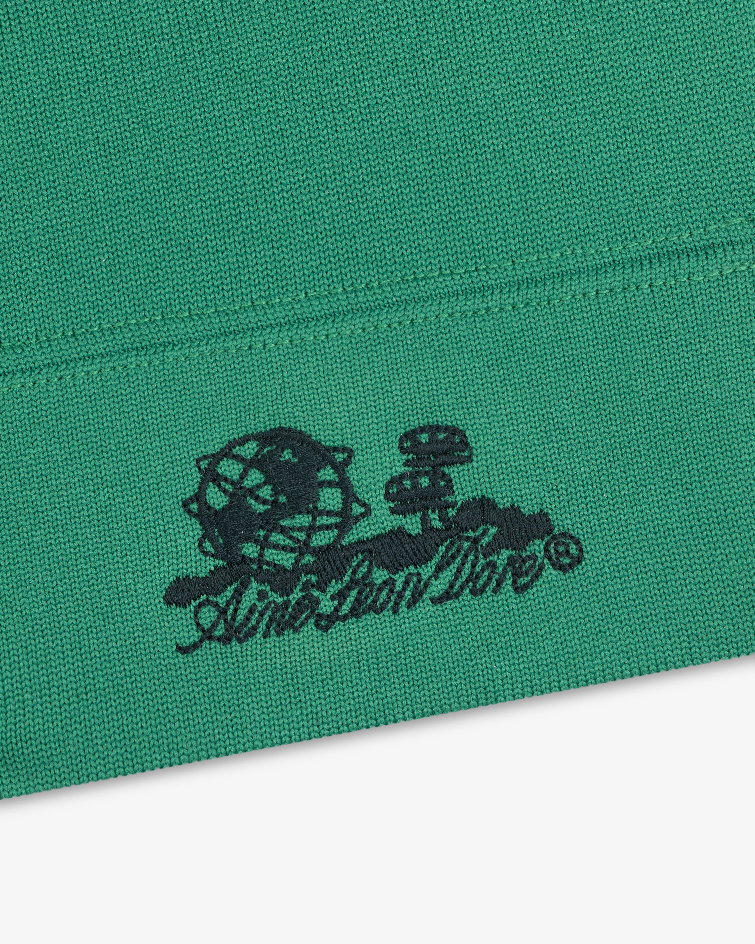 Green Unisphere Skull Cap with black embroidered globe, mushrooms, and “Anti Social Social Club” text below.