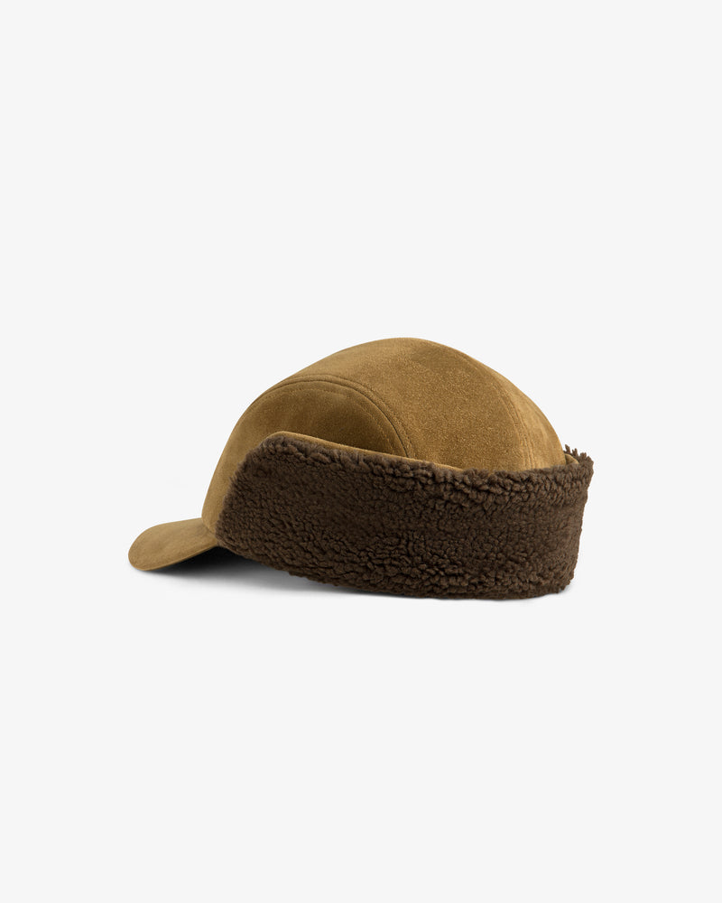 Brown Shearling Earflap Hat with fleece-lined earflaps.