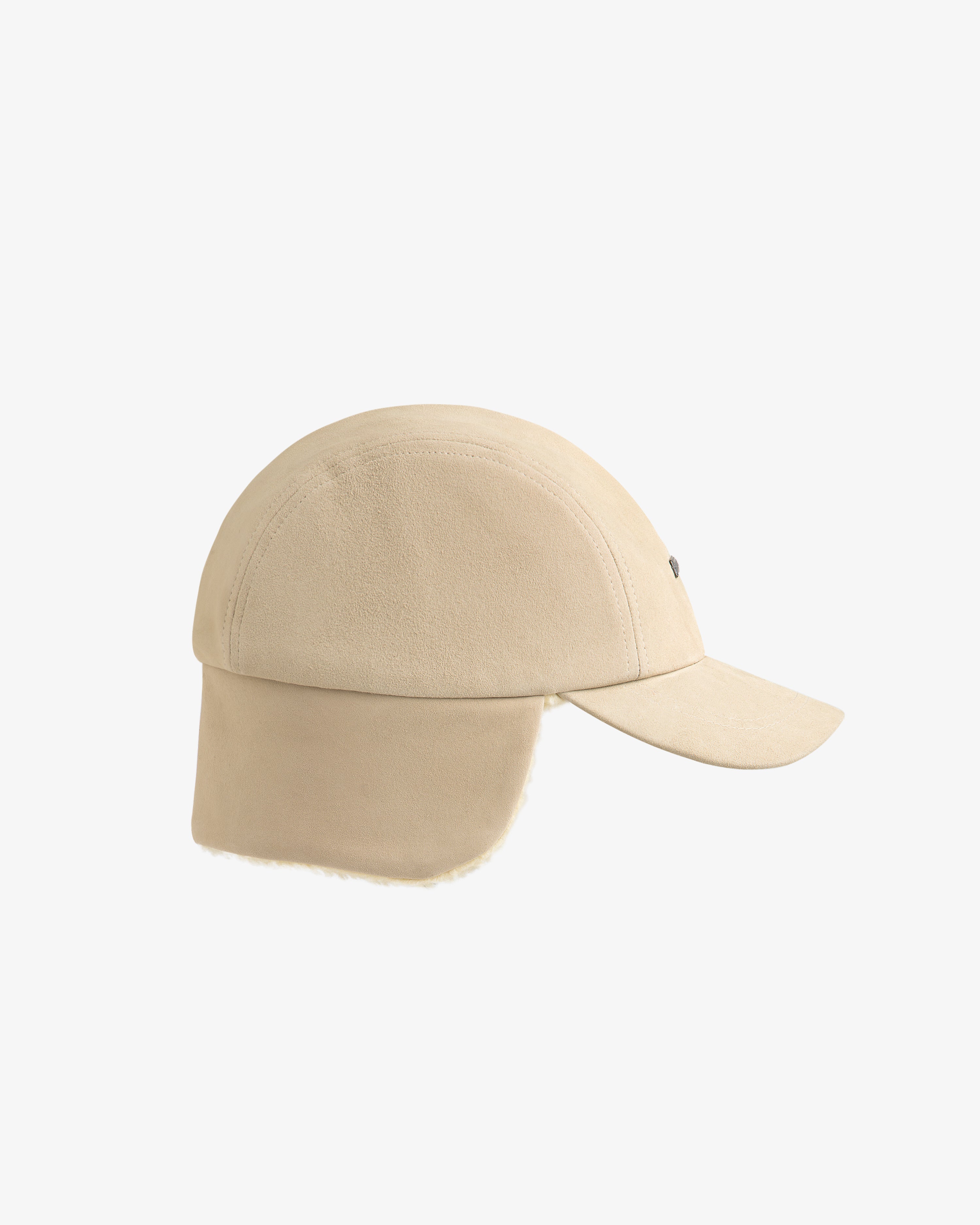 Tan suede Shearling Earflap Hat with fold-down earflaps lined with light-colored fleece.