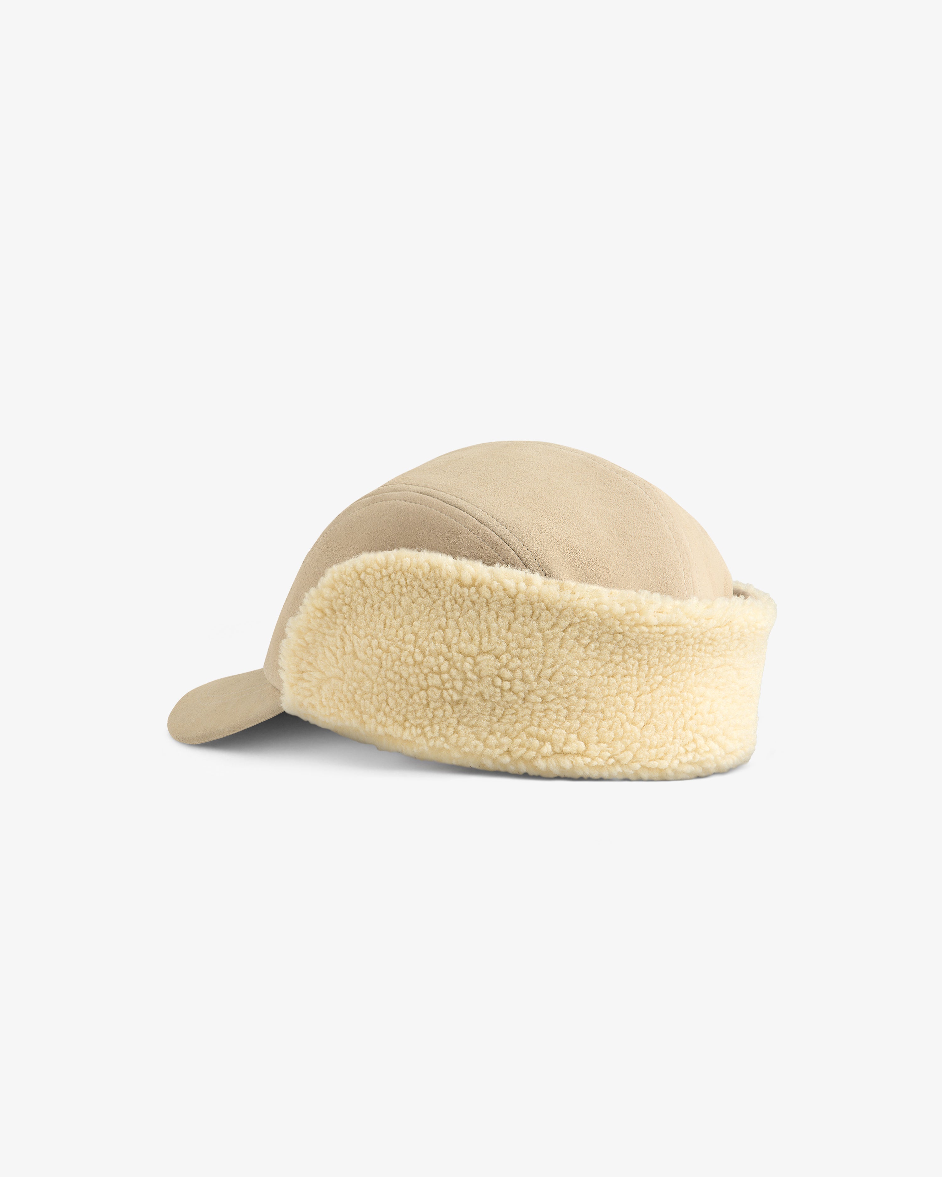 Beige Shearling Earflap Hat with fuzzy fleece earflaps.