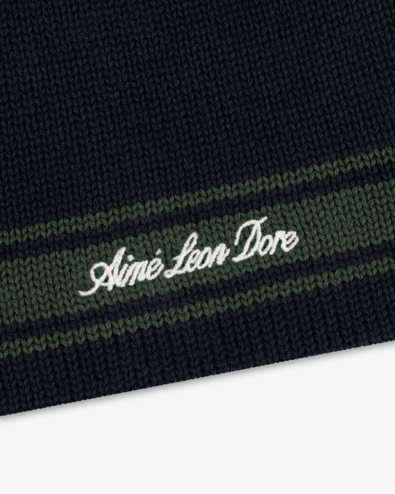 Navy Stripe Knit Beanie with green stripes and Aimé Leon Dore embroidered in white script.