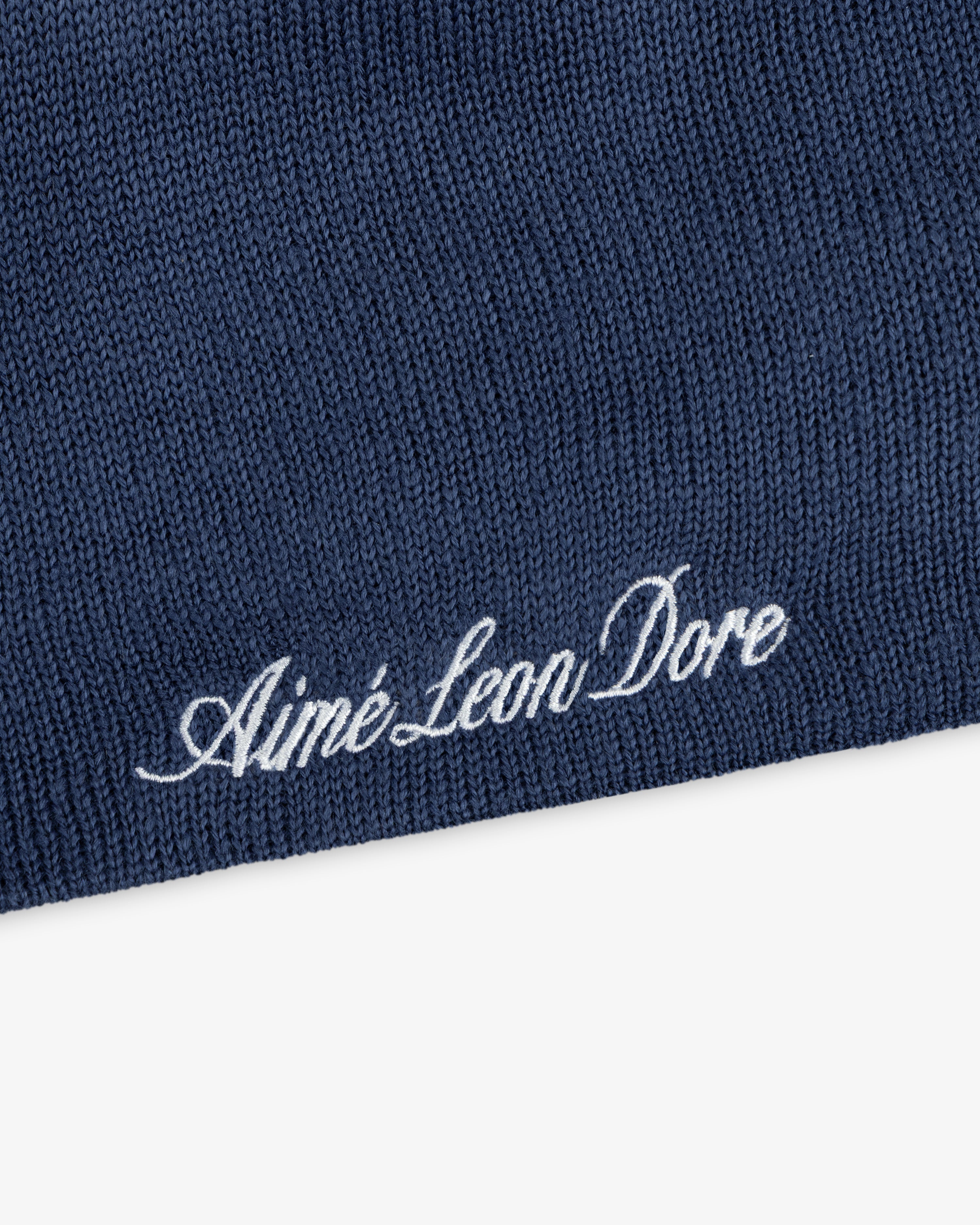 Navy blue ALD / New Era Dodgers Beanie with the brand name embroidered in white cursive script.