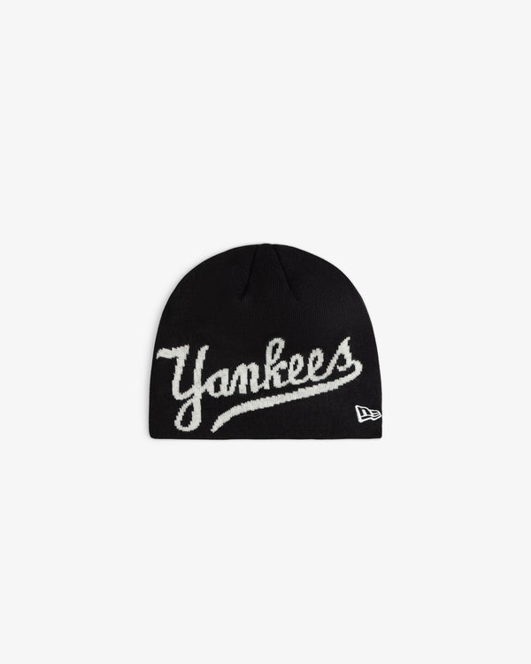 ALD / New Era Yankees Beanie in black knit with white script embroidery on the front.
