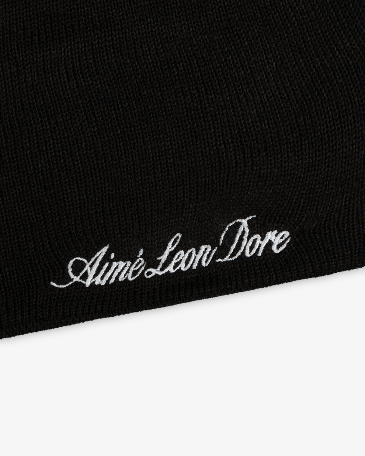 Black ALD / New Era Mets Beanie with white script embroidery reading Aimé Leon Dore.