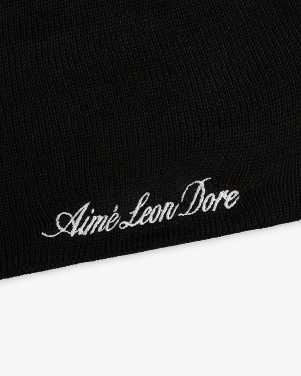 Black ALD / New Era Mets Beanie with white script embroidery reading Aimé Leon Dore.