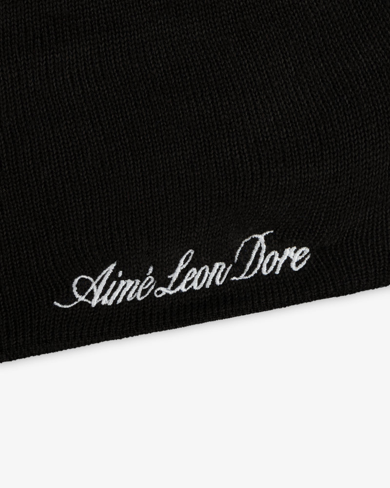 Black ALD / New Era Mets Beanie with white script embroidery reading Aimé Leon Dore.