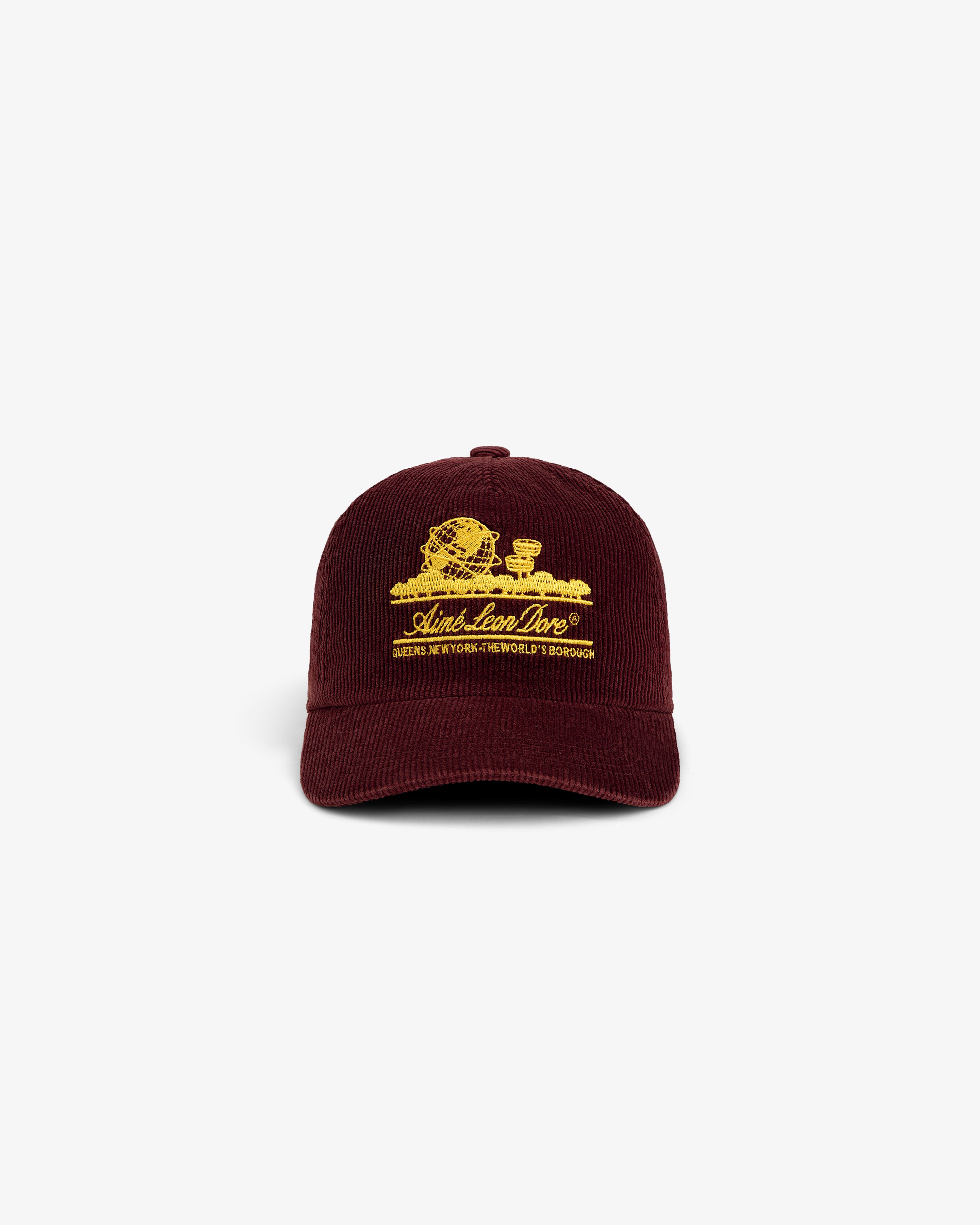 Burgundy Corduroy Unisphere Hat featuring an embroidered gold globe logo and text.