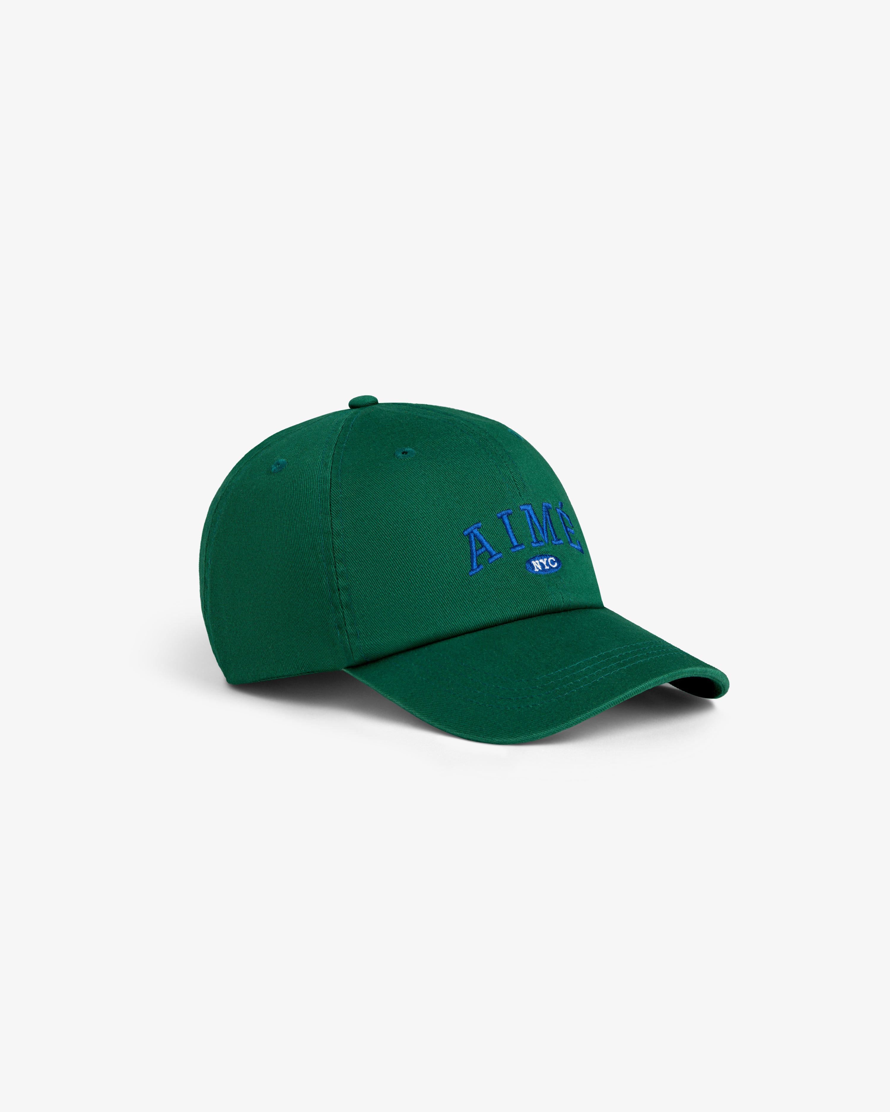 Aimé Souvenir Hat: green cap with blue “AIME NYC” embroidery, displayed on a plain white background.