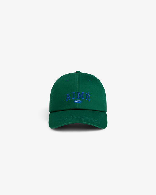 Aimé Souvenir Hat: green cap with AIMÉ NYC in blue embroidery, displayed on a plain white background.
