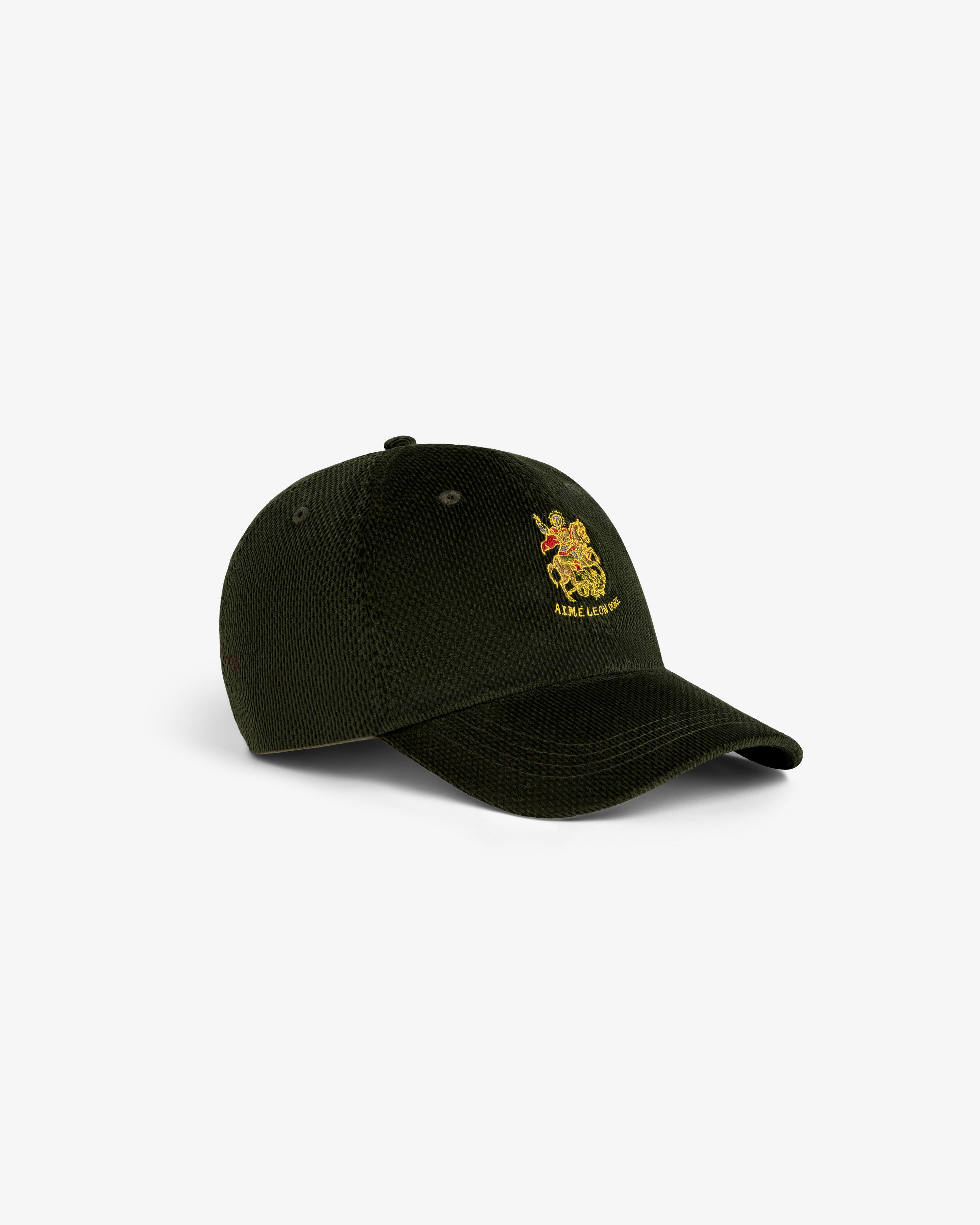 Saint George Corduroy Hat in dark green with yellow embroidered crest and text on front, shown at a slight angle.
