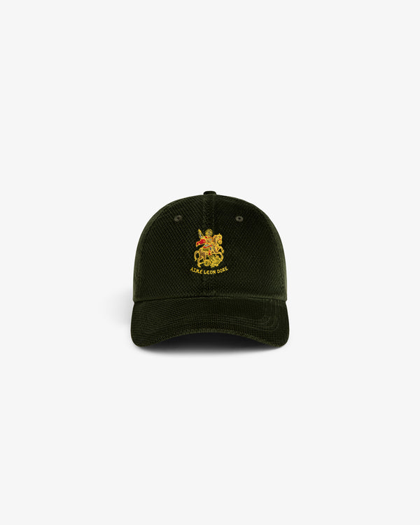 Saint George Corduroy Hat in dark green with yellow crest and “LUXE LION CREW” embroidered on the front.