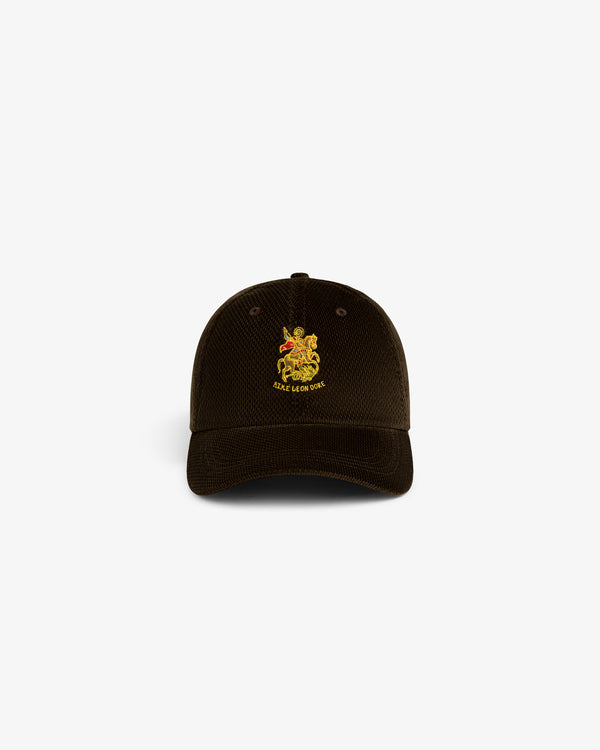 Brown corduroy Saint George Hat with yellow crest and SILAS & THE CAT text embroidered on the front.