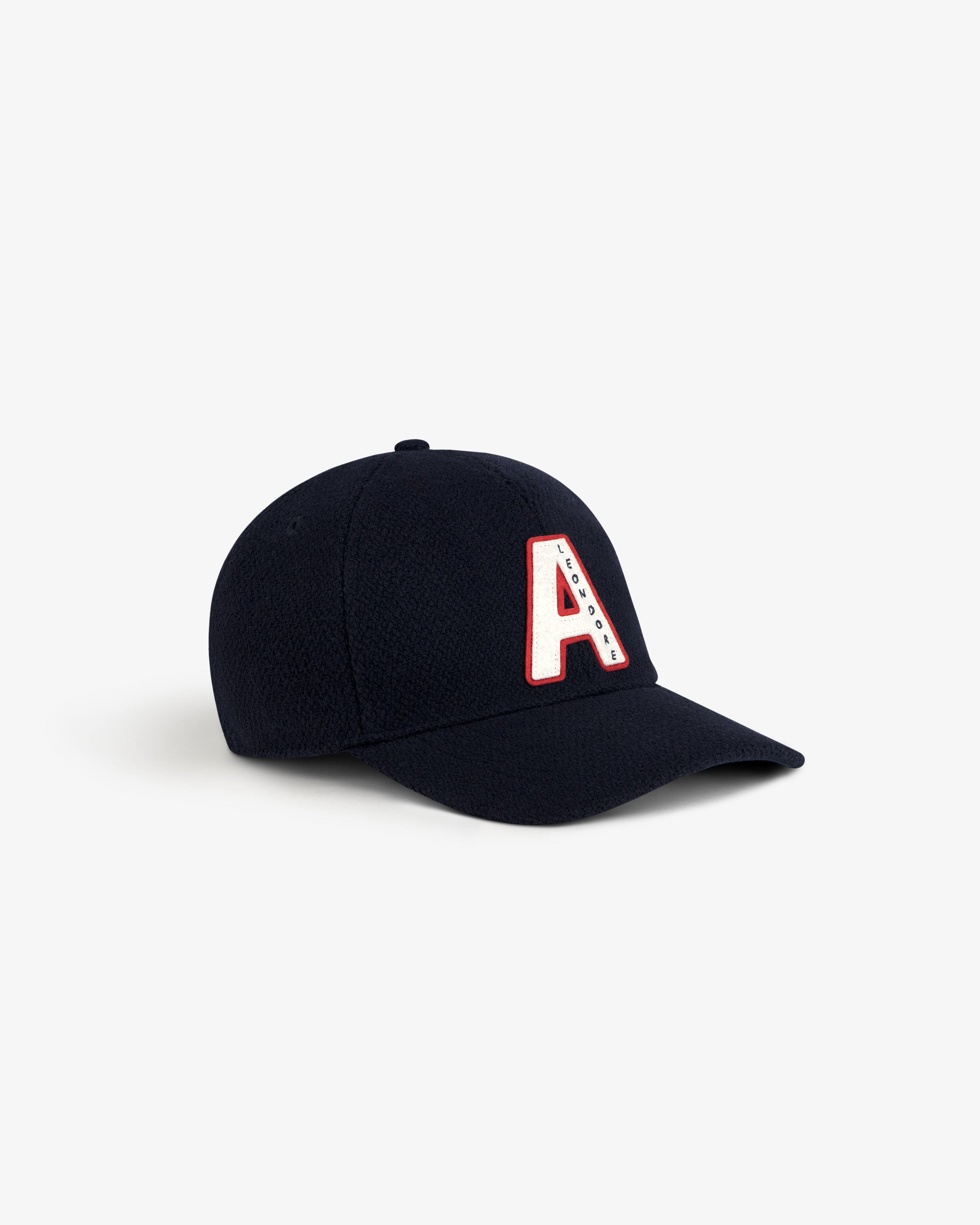 Wool Varsity Logo Hat: navy blue baseball cap with a white and red varsity-style letter A patch on the front.