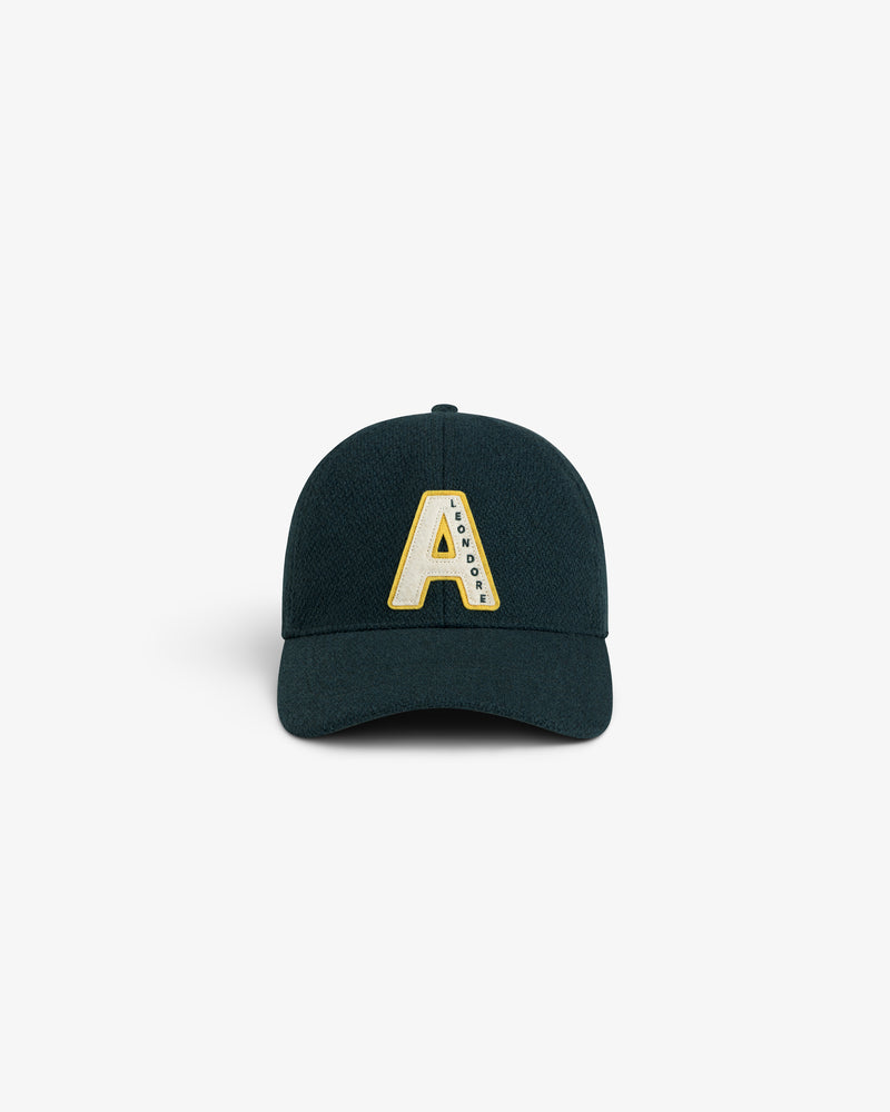 Wool Varsity Logo Hat in dark green, featuring a cream and yellow letter A patch with small text on the right side.