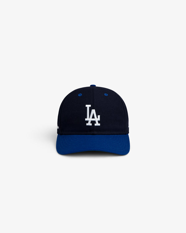 ALD / New Era Dodgers Retro Fit Hat featuring a navy blue crown, royal blue brim, and a white LA logo.