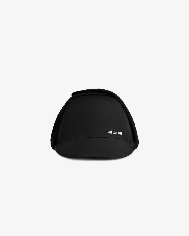 Black Fleece Lined Earflap Hat with textured trim and AIME LEON DORE text.