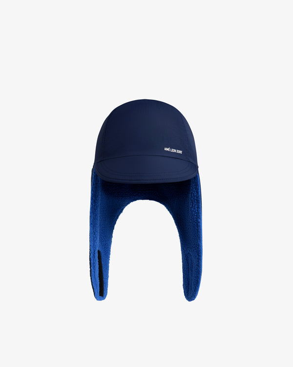 Navy blue Fleece Lined Earflap Hat with a fleece lining and brand text on the brim.