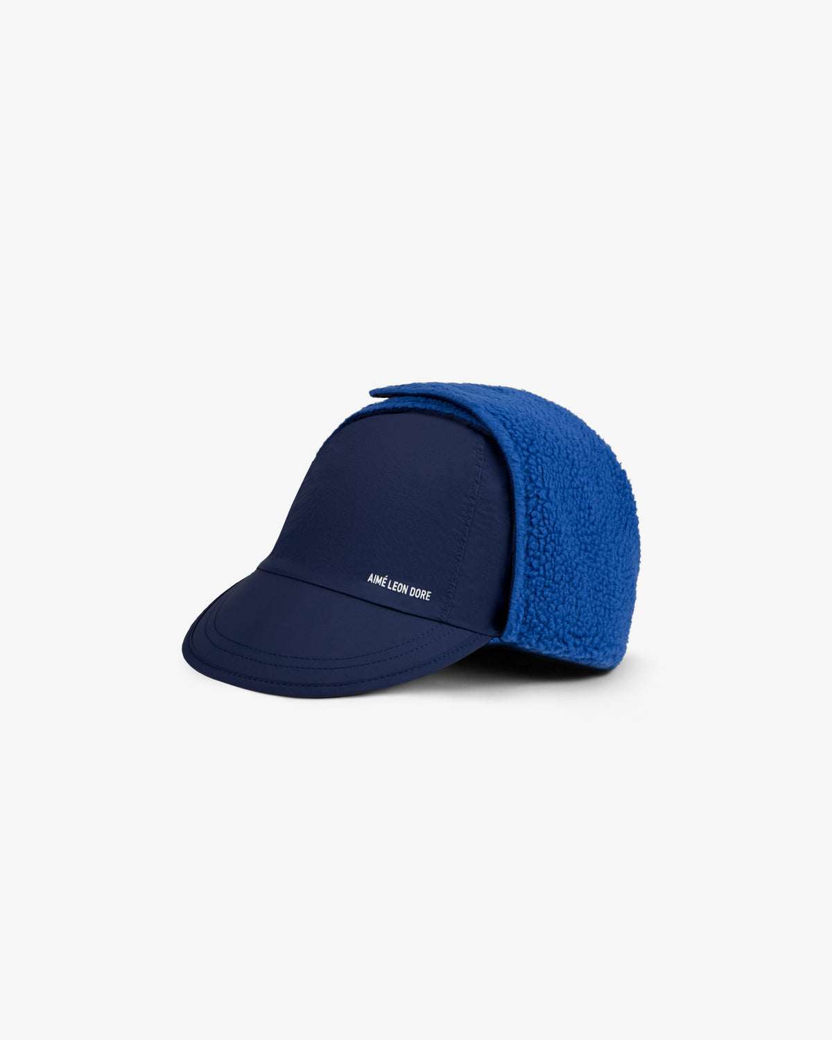 Fleece Lined Earflap Hat in navy blue with a curved brim and bright blue textured fleece earflaps.