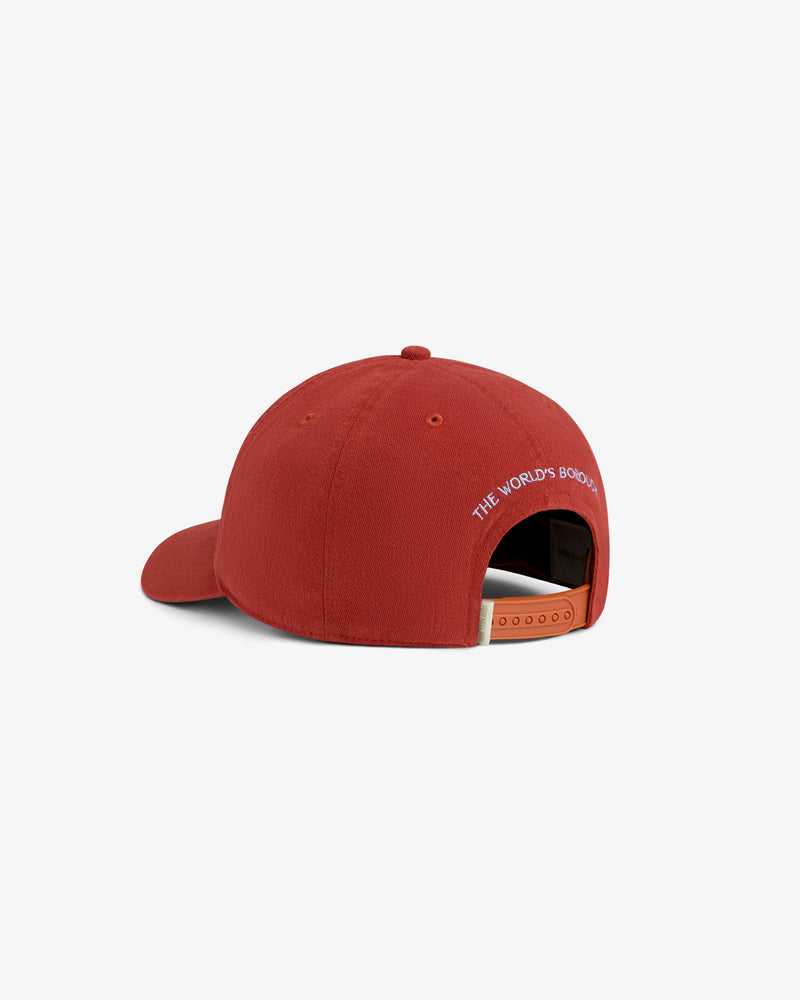 Red Atlas Logo Hat with THE WORLDS BOROUGH embroidered in white above the strap.