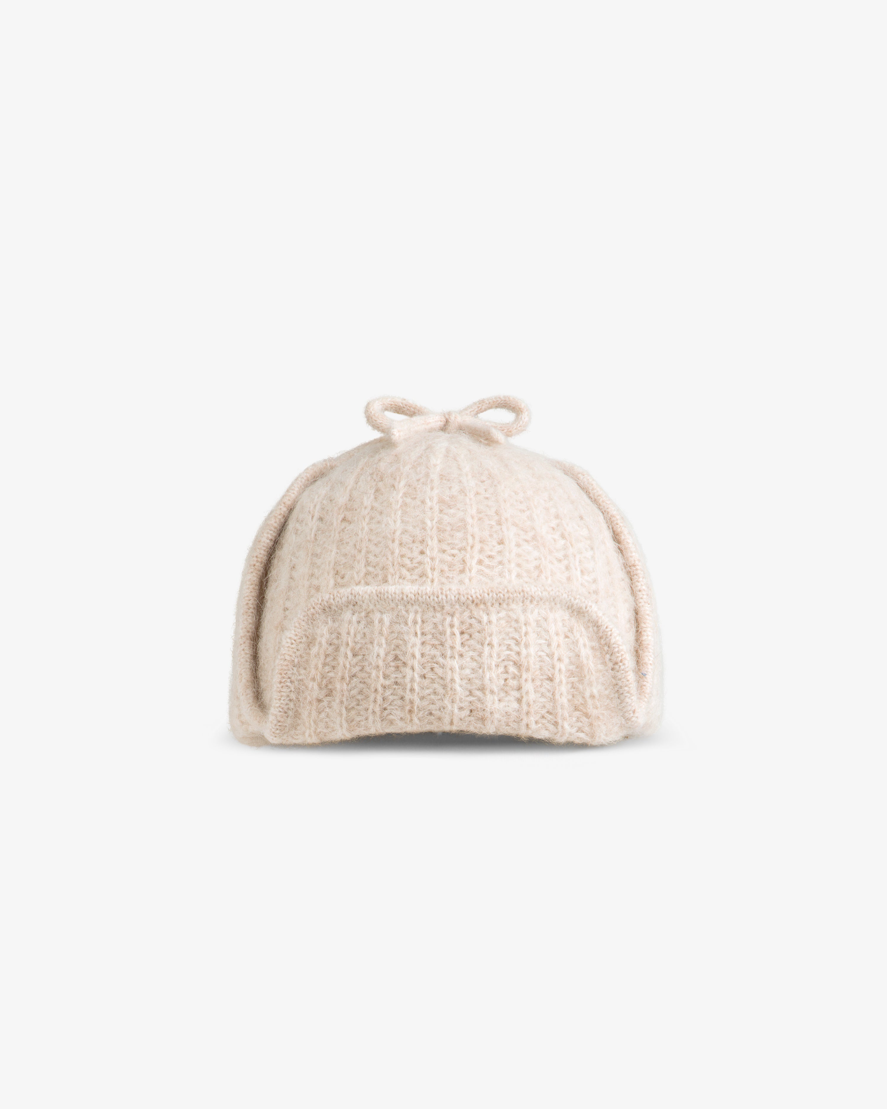 Beige Alpaca Wool Knit Earflap Hat with a small bow on top.