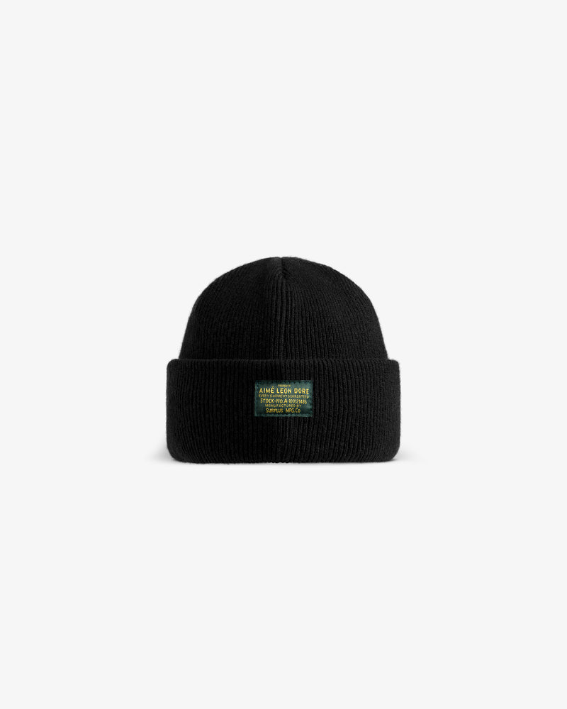 Black ribbed Wool Brim Beanie with a rectangular patch featuring yellow text.