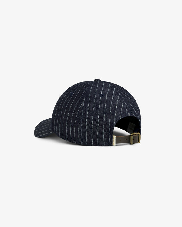 Chalk Stripe Logo Hat in navy blue shown from the back with adjustable strap and metal buckle.