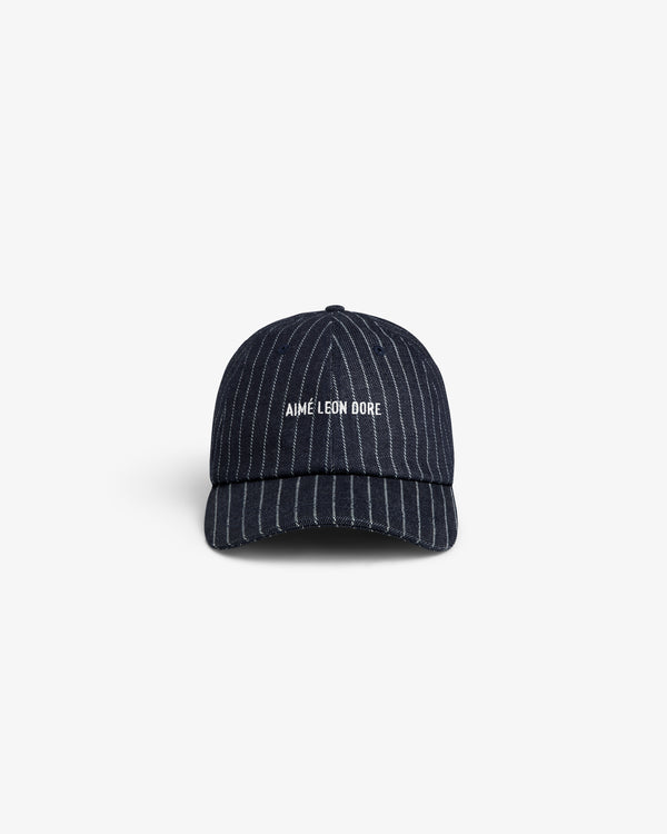 Chalk Stripe Logo Hat in navy with AIMÉ LEON DORE white front embroidery, pinstriped and shown from the front.