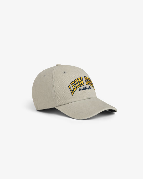 Mulberry Letterman Hat in beige with LEON DORE and Madeleine, NY embroidered in yellow and black on the front.