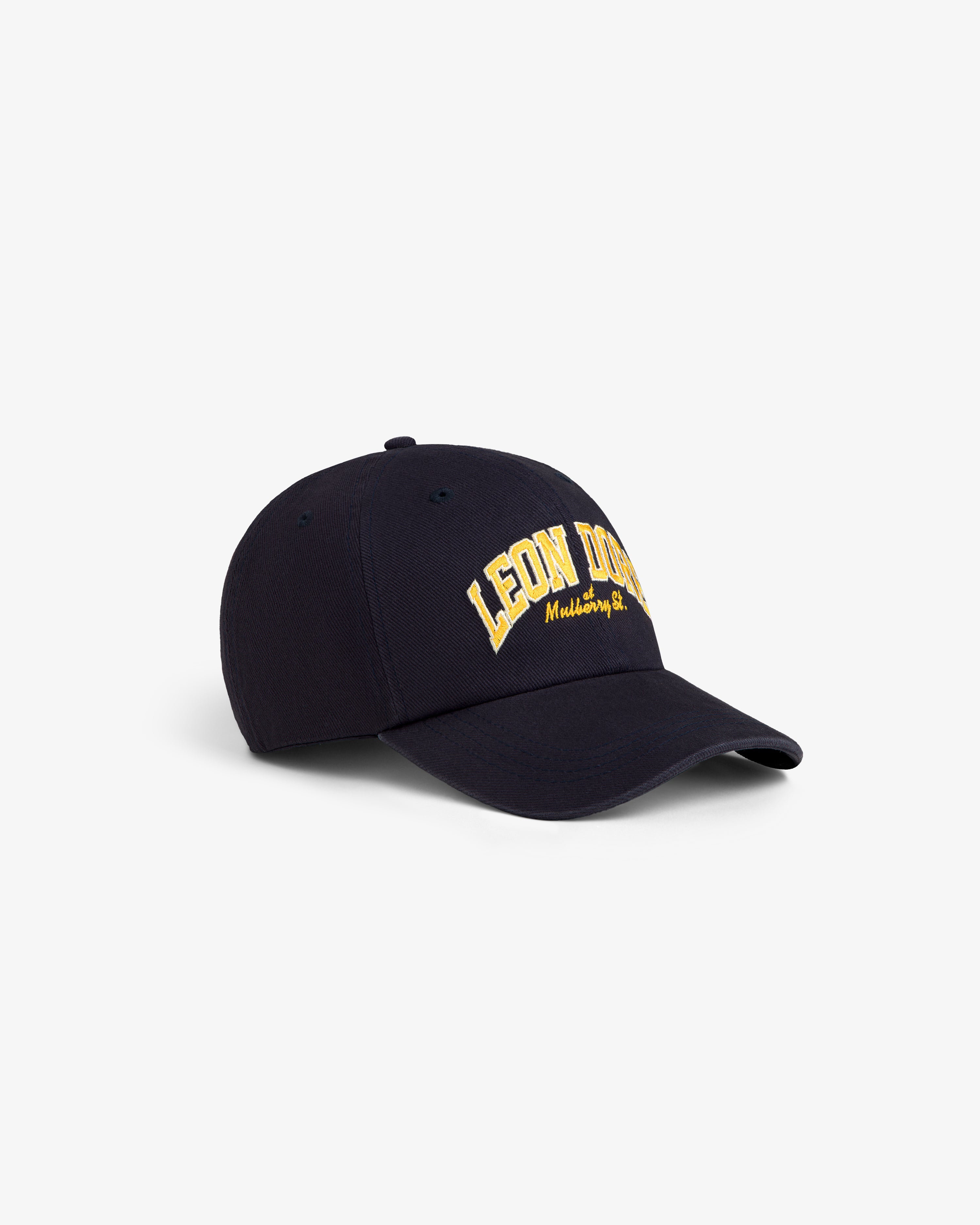 Mulberry Letterman Hat: Navy baseball cap with yellow “LEON DORE” embroidery on the front.